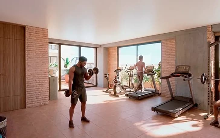 Render del gimnasio de Torre Rosetta con máquinas de cardio, pesas y ventanales con luz natural